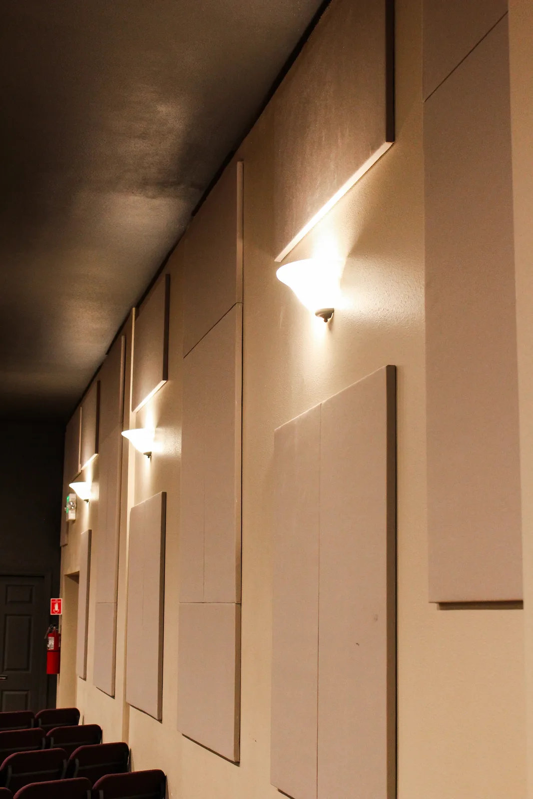 Wall sconce lighting along the sanctuary