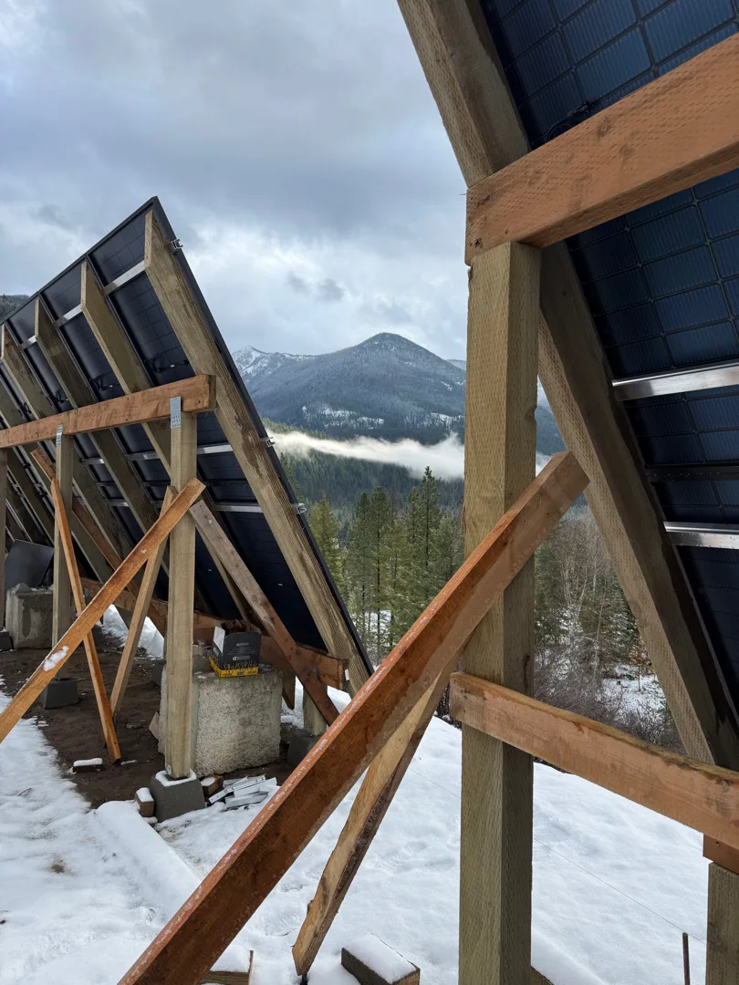Solar array support structure framed against the mountains